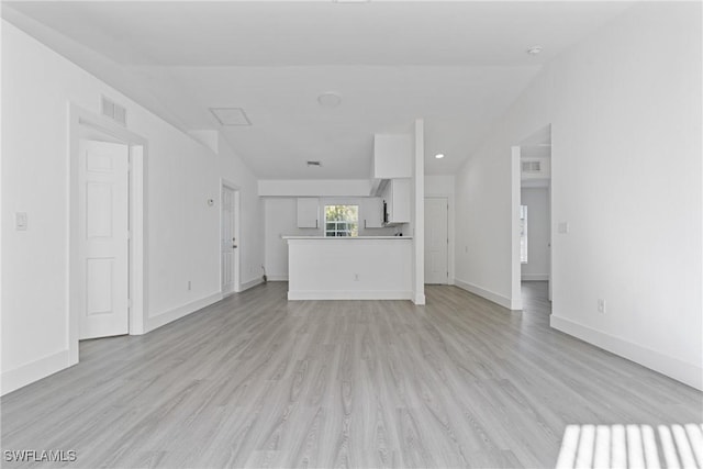 unfurnished living room featuring light wood-type flooring