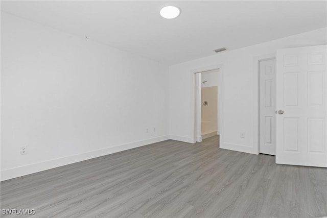 unfurnished bedroom featuring light wood-type flooring