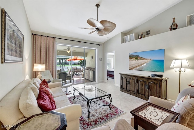 living room featuring ceiling fan, lofted ceiling, and light tile patterned floors