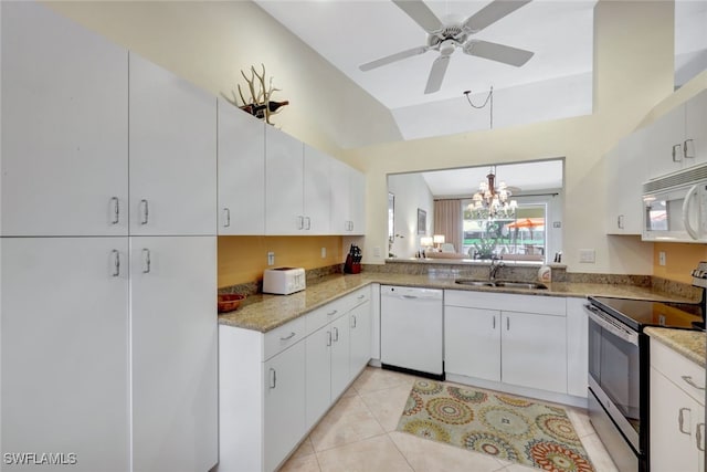 kitchen with hanging light fixtures, white cabinetry, sink, and white appliances