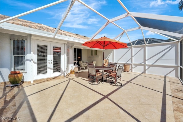 view of patio / terrace featuring a lanai and french doors