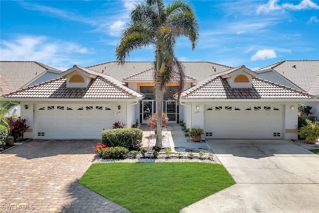 view of front of property with a garage