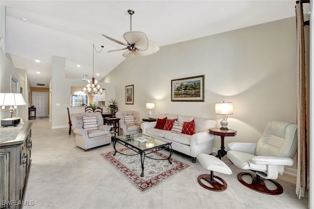 living room featuring ceiling fan with notable chandelier, light tile patterned floors, and high vaulted ceiling