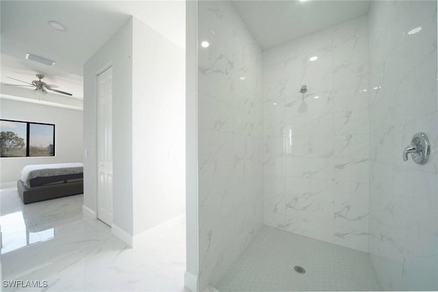 bathroom with ceiling fan and a tile shower