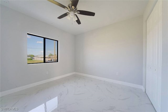 unfurnished room with ceiling fan