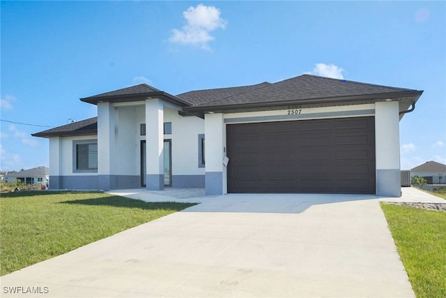 view of front of home with a garage and a front yard