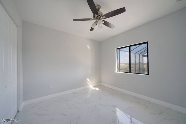 spare room with ceiling fan