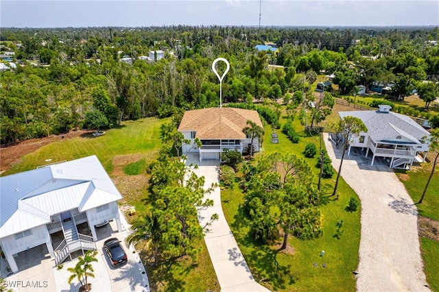 drone / aerial view featuring a view of trees