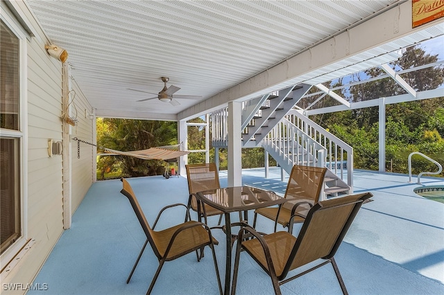 10800 Habitat Cir, Bokeelia, FL 33922 - view of patio / terrace with stairway, ceiling fan, and outdoor dining space