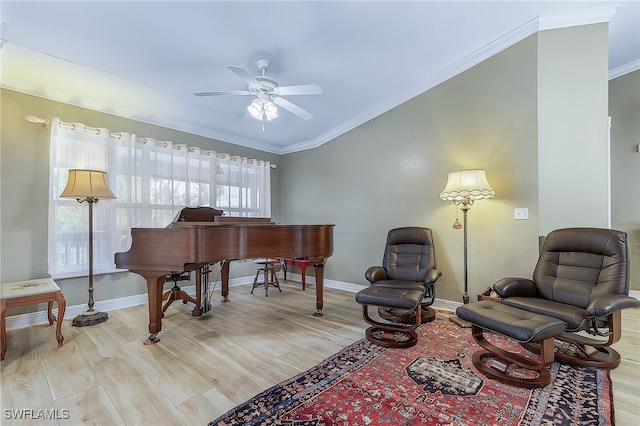 10800 Habitat Cir, Bokeelia, FL 33922 - sitting room featuring wood finished floors, a ceiling fan, crown molding, and baseboards