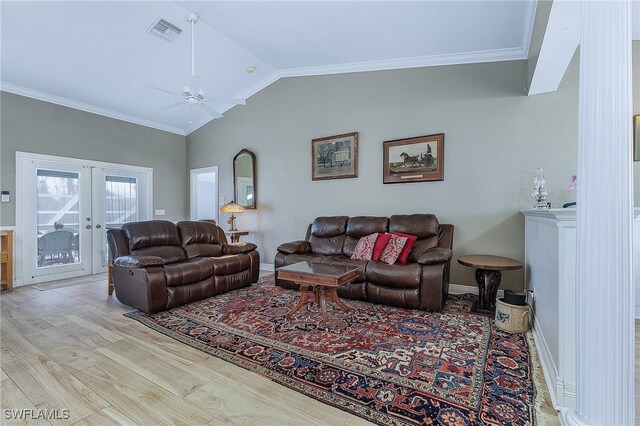 10800 Habitat Cir, Bokeelia, FL 33922 - living room with wood finished floors, lofted ceiling, a ceiling fan, french doors, and ornamental molding