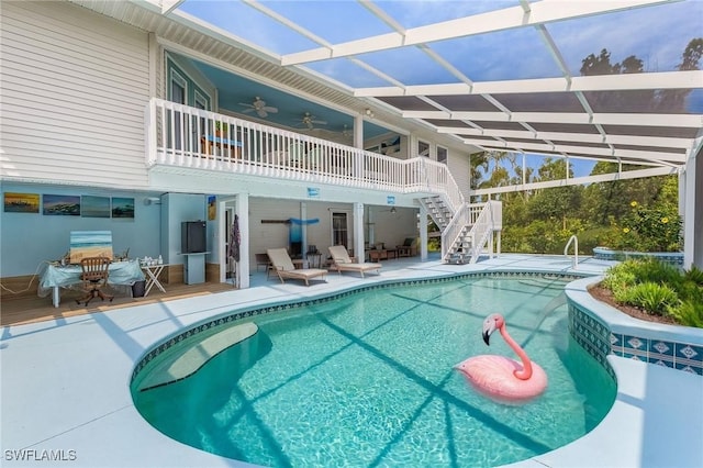 10800 Habitat Cir, Bokeelia, FL 33922 - outdoor pool featuring ceiling fan, stairs, a patio area, and a deck