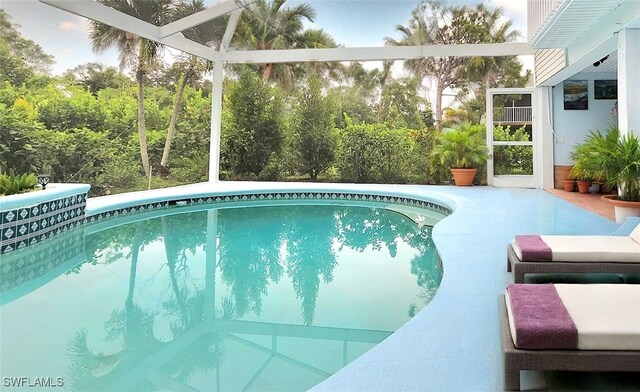 10800 Habitat Cir, Bokeelia, FL 33922 - outdoor pool featuring glass enclosure