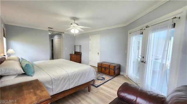 10800 Habitat Cir, Bokeelia, FL 33922 - bedroom featuring light wood finished floors, a closet, ornamental molding, and ceiling fan
