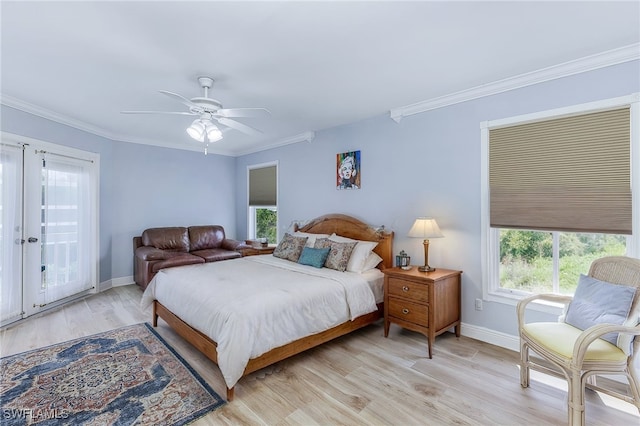 10800 Habitat Cir, Bokeelia, FL 33922 - bedroom featuring baseboards, light wood-style floors, ornamental molding, and ceiling fan