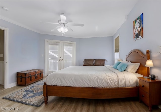 10800 Habitat Cir, Bokeelia, FL 33922 - bedroom with ornamental molding, access to exterior, french doors, wood finished floors, and ceiling fan