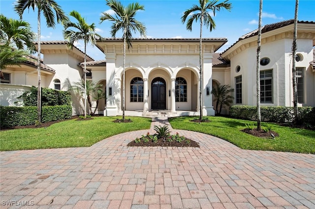 6511 Highcroft Dr, Naples, FL 34119 - mediterranean / spanish-style house with stucco siding, a front yard, and a tile roof