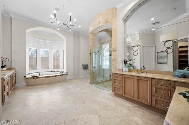 full bathroom featuring ornamental molding, a garden tub, vanity, and a shower stall