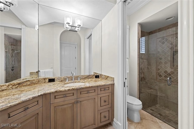 bathroom with toilet, a stall shower, tile patterned floors, and vanity