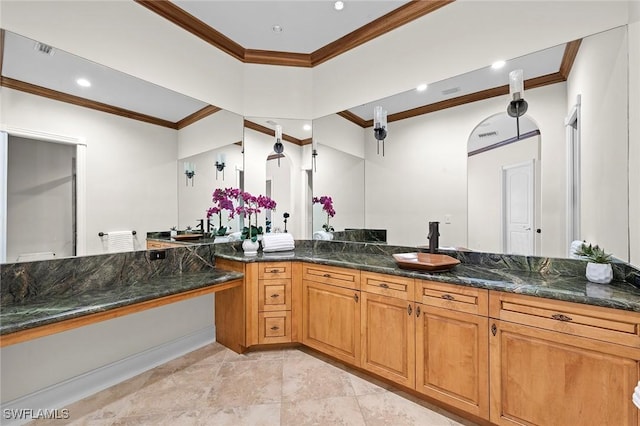 bathroom with visible vents, ornamental molding, and vanity