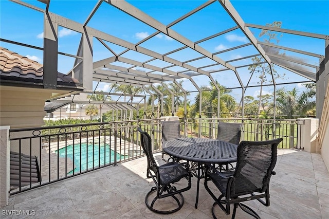 view of patio featuring a lanai and a fenced in pool