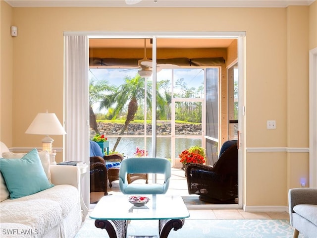 tiled living room with ceiling fan