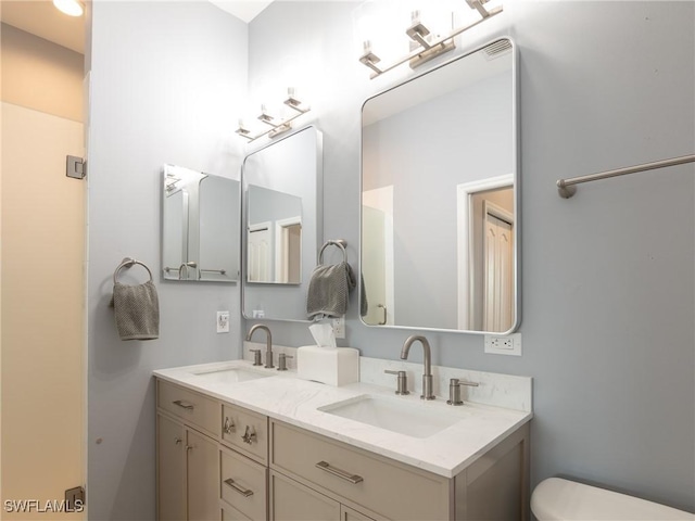 bathroom with vanity and toilet