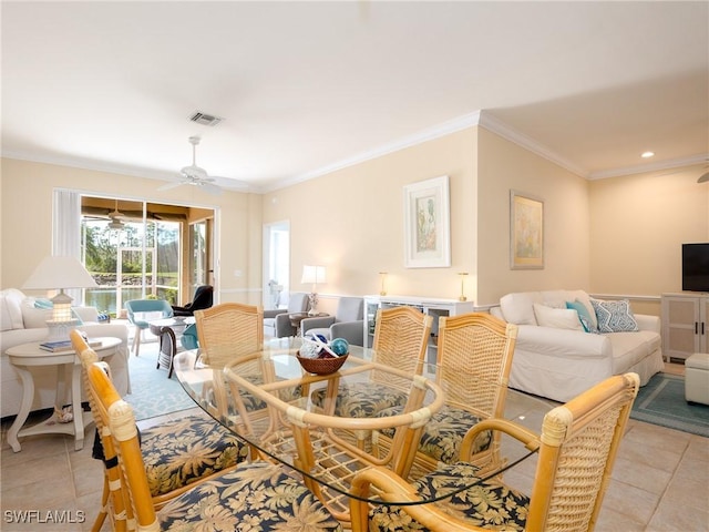 dining area with ceiling fan, light tile patterned floors, and crown molding