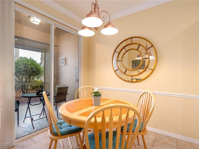 dining space with crown molding and light tile patterned floors