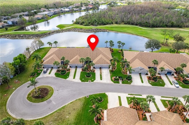 birds eye view of property with a water view