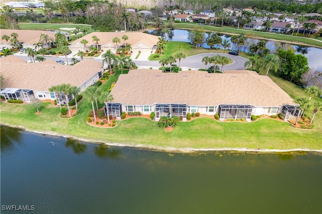 drone / aerial view with a water view