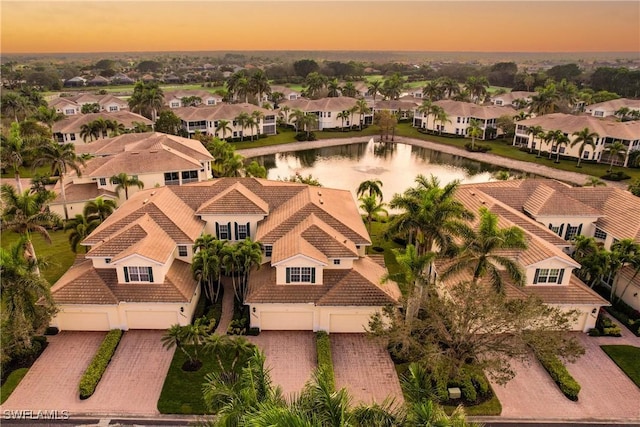 aerial view featuring a water view and a residential view