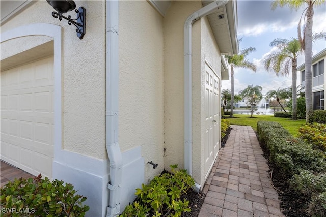 view of home's exterior featuring a garage and stucco siding