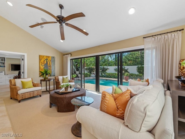 living room with vaulted ceiling, light tile patterned flooring, and ceiling fan