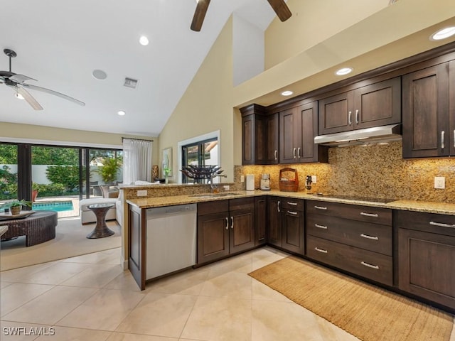 kitchen featuring light stone counters, dishwasher, kitchen peninsula, and light tile patterned floors