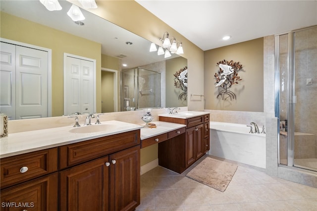 bathroom with tile patterned flooring, vanity, and separate shower and tub