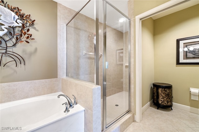 bathroom featuring independent shower and bath and tile patterned floors