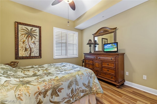 bedroom with ceiling fan and light wood-type flooring