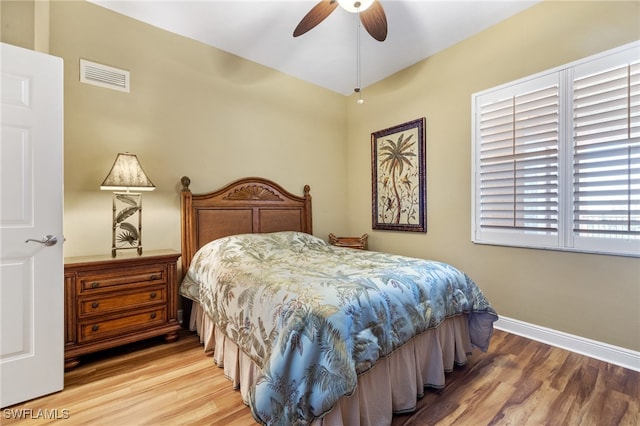 bedroom featuring ceiling fan and wood-type flooring