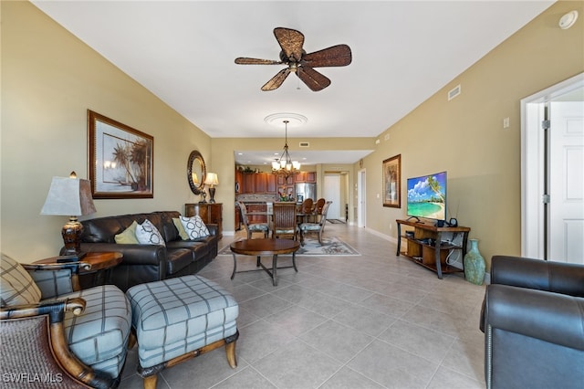 living room with light tile patterned floors and ceiling fan with notable chandelier