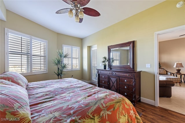 bedroom featuring dark hardwood / wood-style floors and ceiling fan