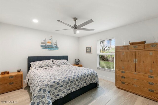 bedroom featuring baseboards, ceiling fan, recessed lighting, and light wood finished floors