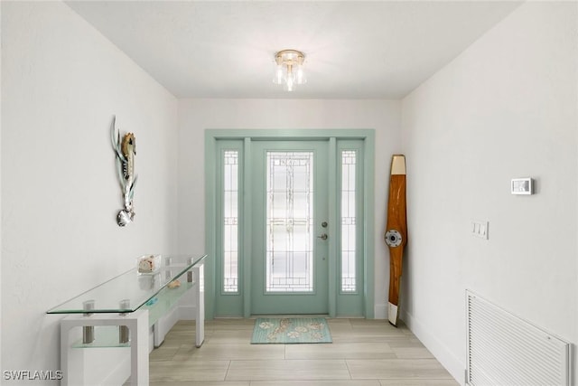 foyer entrance with a wealth of natural light