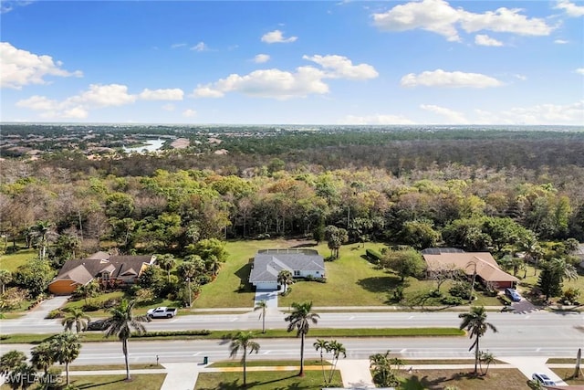 bird's eye view featuring a wooded view