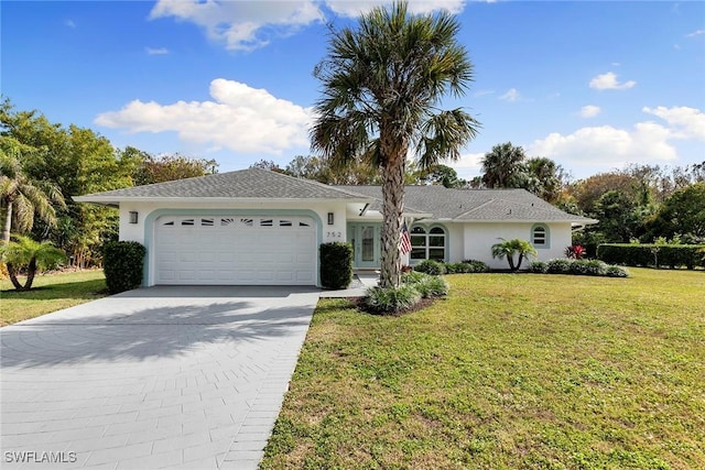 single story home featuring driveway, stucco siding, a front yard, and an attached garage