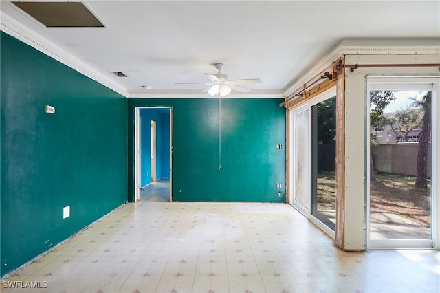 spare room featuring crown molding and ceiling fan