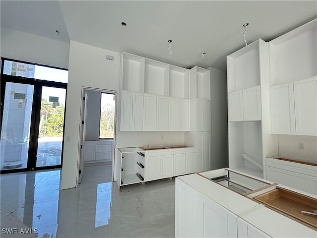 kitchen featuring white cabinetry