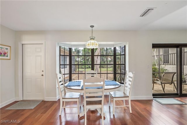 dining area featuring hardwood / wood-style floors