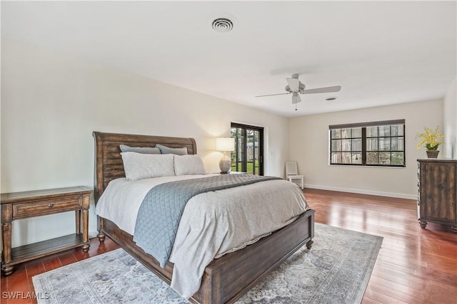 bedroom featuring ceiling fan and dark wood-type flooring