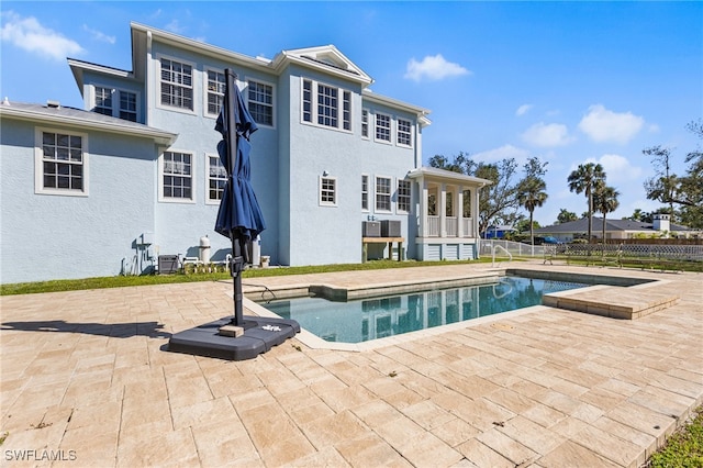 view of pool with a patio, fence, and a fenced in pool